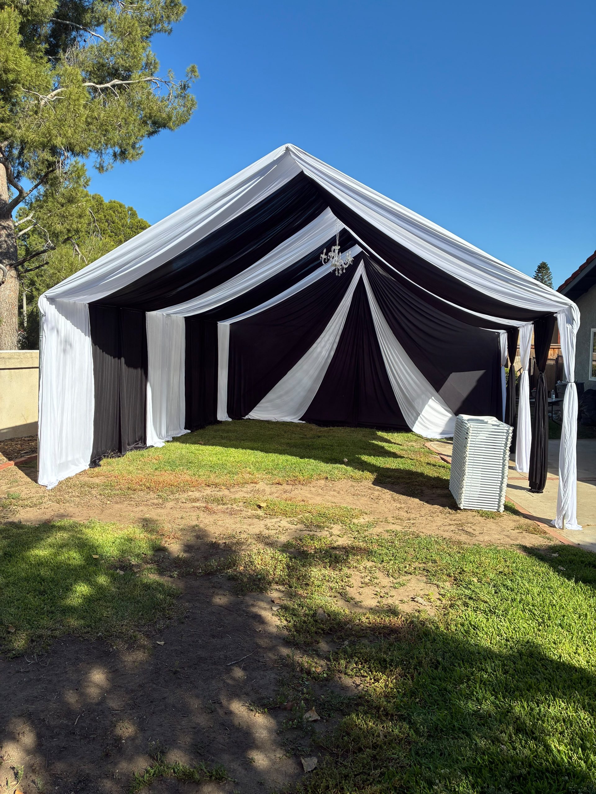 Real Loren's Party Rentals Contrasting black and white ceiling and wall draping. Style inspiration, not a size-specific product photograph.