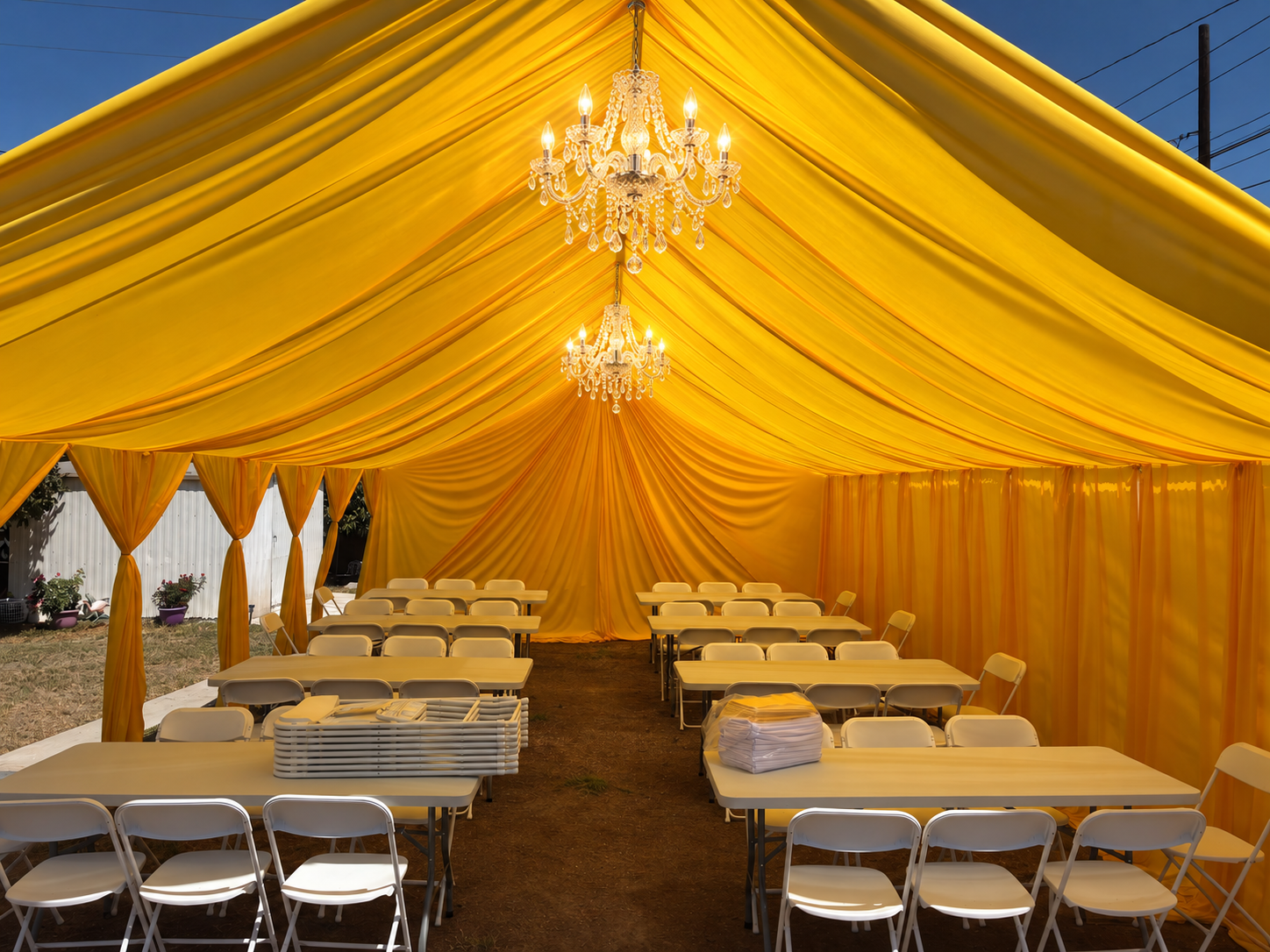 Golden reception decor with crystal chandeliers and elegant event styling